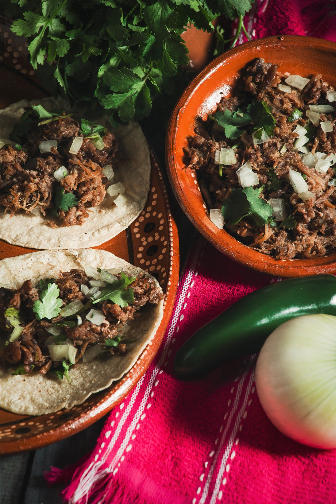  Tacos  and Barbecue on Mexican Clay Plates on Pink Tablecloth